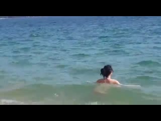 wife swimming in mini thong bikini